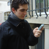 Henri playing with his cell phone