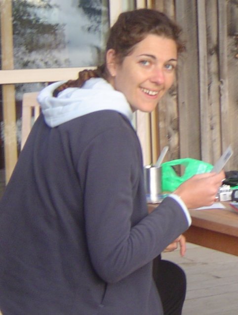 Coralie writing postcards from Akaroa