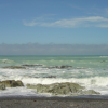 Pacific ocean, waves, rocks, green water, blue sky