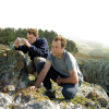 Joel and Nico crouching on rocks