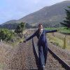 Coralie walking on a train track