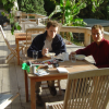 Joel and Fabrice seating on the terrace