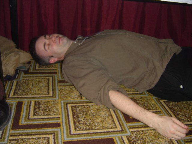Danbri under the table, pretending to sleep, Hyatt Harborside