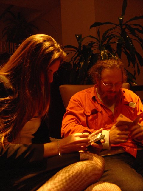 Coralie Mercier holding a pda, Charles McCathieNevile reading a book, Hyatt Harborside, Boston