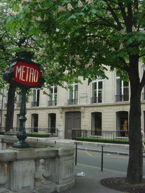 Metro sign, Gucci shop, trees