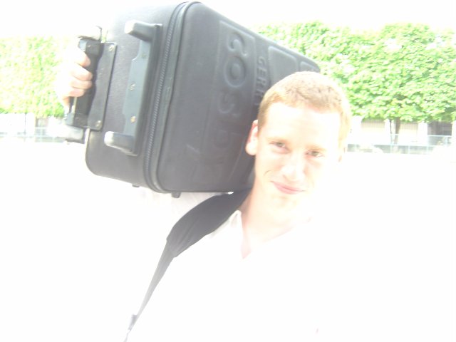 Eric carrying his suitcase