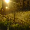 Paris at night: stairs, brick wall, street light