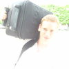 Eric carrying his suitcase