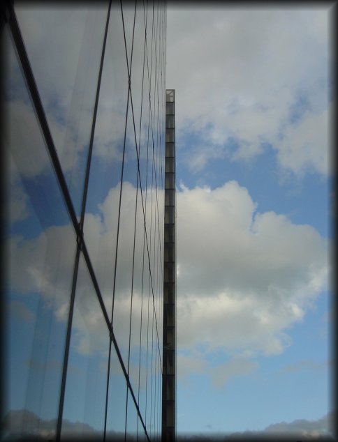 Sky and clouds mirrored at the Francois Mitterand Library (BNF)