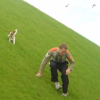 Dog chewing on ball and ericP climbing down Bercy