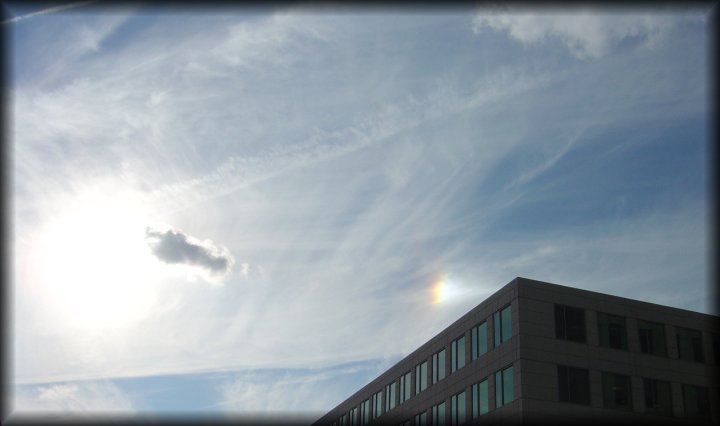 A peculiar tiny and bright rainbow
