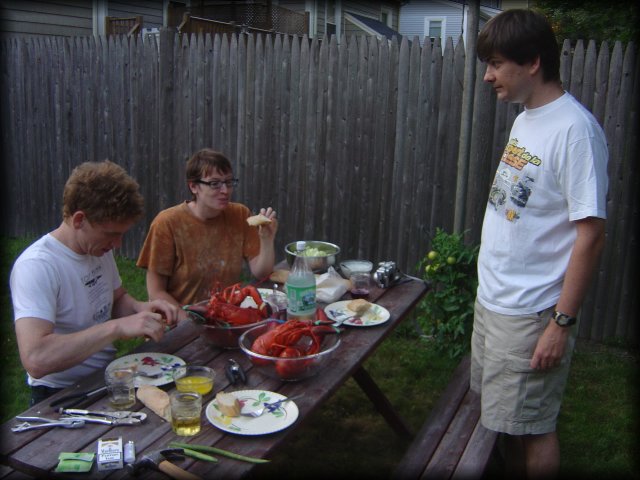 ericP working on a lobster, Jennifer eating home made bread, Philippe day dreaming