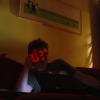 digital clock projected on ericP's face