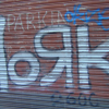 "dork" graffiti on a garage door