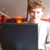 EricP smiling behind his computer