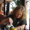 Libby pouring cream in her tea