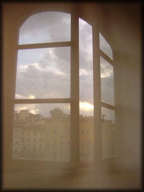 Open window on the southern bank of the Arno, behind a large and heavy cream translucid curtain, on the way out of the Galeria degli Uffizi, Firenze