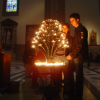 Young couple holding hands after lighting a candle in the Cathedral of Santa Maria Del Fiore, Firenze