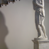 A statue near a staircase playing hide and seek with its shadow, Firenze