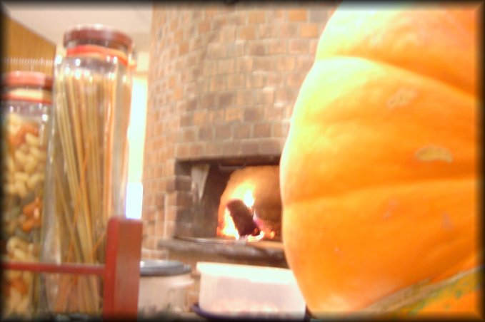 Pasta in jars, brick oven and pumpkin 