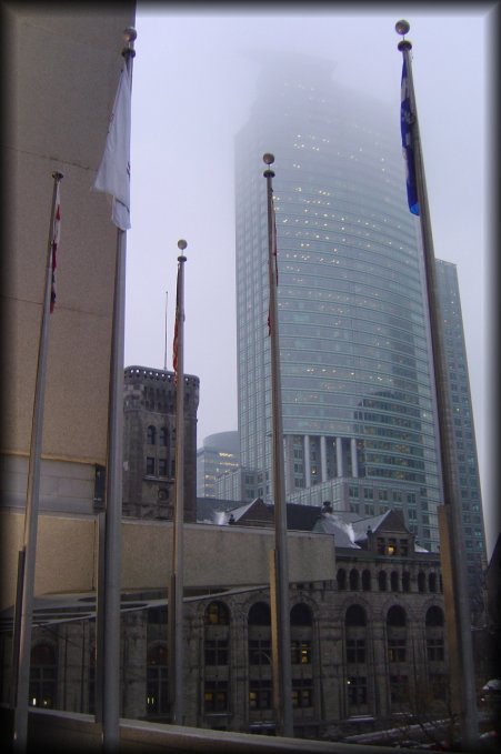 Flags undisturbed, sky-scraper, fog