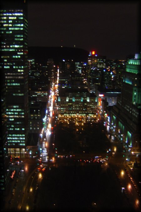 Busy streets below, Mont Royal is in the dark 