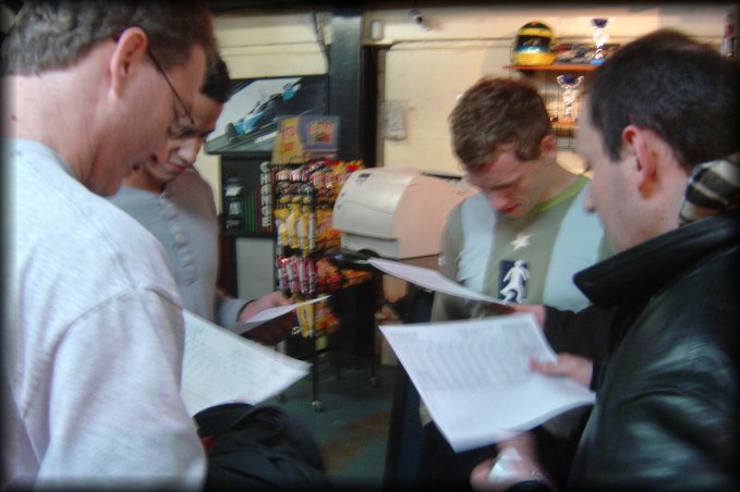 DanC, Dom, ericP and Hugo busy checking their times at the go kart