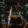 Busy streets below, Mont Royal is in the dark 