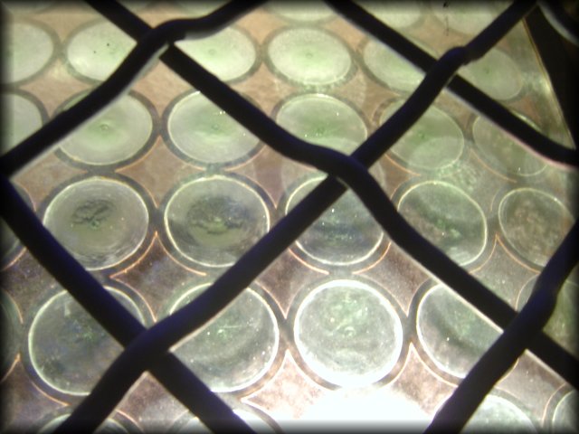 metallic mesh over stained glass