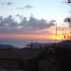 The sun sets behind Villefranche sur Mer