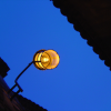 Orange light on a dusk blue sky