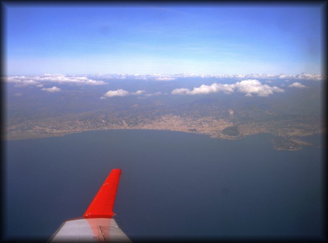 View on the bay of Nice (Nice airport on the left)  and snow covered mountains in the background (the Alps), from my window seat in the Air Nostrum NCE-BCN flight.