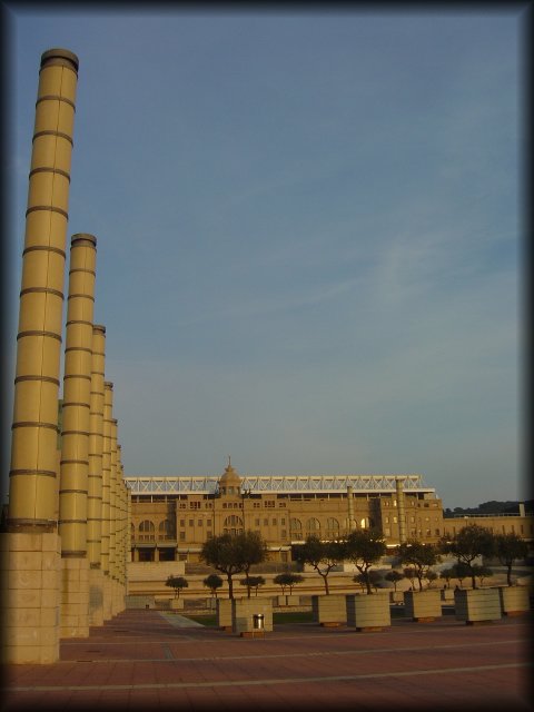 Estadi Olimpic de Montjuic Lluis Companys, the columns on the left seem to be soaring.