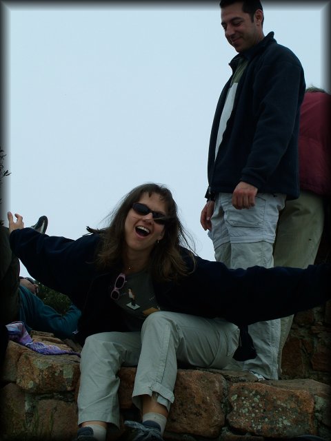 Caroline, her arms stretched out and making a funny face (Jean-Luc behind her smiling knowingly) (Caro, I know you want that one deleted; make your offer a.s.a.p)