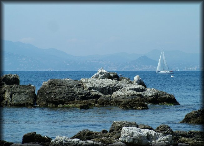 More rocks, a sailboat and Mandelieu in the background