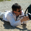 Guillaume, still on flat on his belly, checking the photo he just took