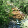 Red sand from the mountains at the bottom of the Roudoule river