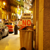 After a demonstration a poster reading "Abuso Policial NO" has been planted in a trash can
