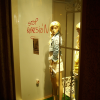 "Stop Repression" hand written on a shop window above a press clipping 