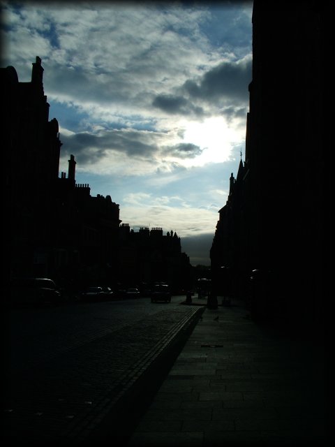 Some street in Edinburgh, late sun, clouds.