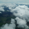The aircraft took off from London Stansted and below us is a field of clouds and below them are fields of crop and below them...