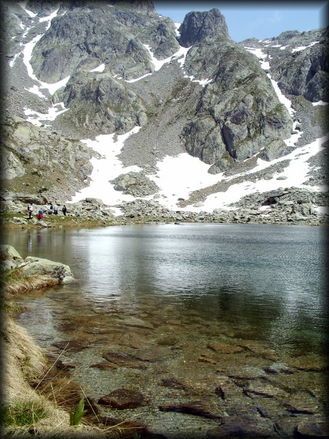 Reflection of the white of the snow in the lake.