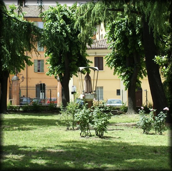A Madonna in the middle of a garden.