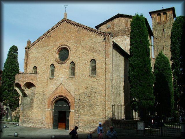 Basilica di Santo Stefano under a blue sky and in the sun.