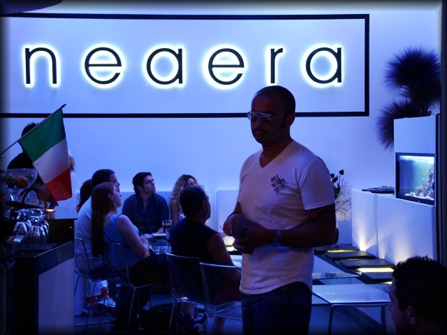 The famous fishtank at Neaera. From that angle, it looks like they're looking at the fishtank. The TV is hidden above it and it's the World Cup they're really engrossed in.
