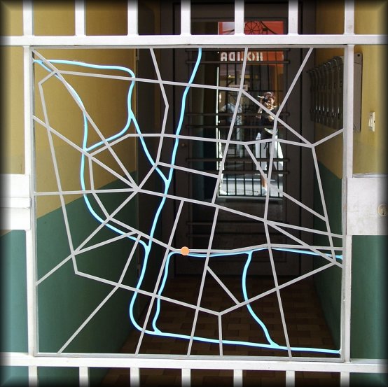 This is an iron map of Bologna, in the centre of a gate. Behind me is the entrance of the Hotel Holiday where I had stayed the night before.
