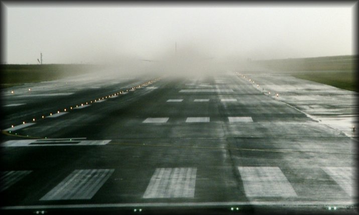 Behind the mist is the aircraft that is taking off. We're next.