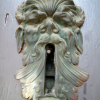 A huge yawning keyhole on a huge door at the University.
