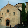 Basilica di Santo Stefano under a blue sky and in the sun.