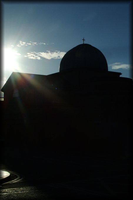 Facing the sun and a church, turned black.